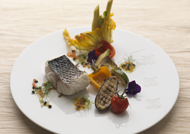 Thick sea bass steak with wild fennel stems, confit Provencal vegetables and vierge sauce