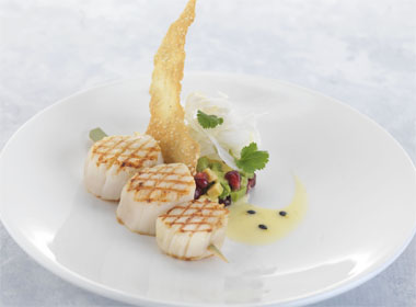 Grilled scallops, fennel, avocado and pomegranate salad, passion fruit dressing, sesame tuile