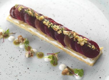 Beetroot, onion and goat’s cheese tart, walnut dressing and frosted walnuts