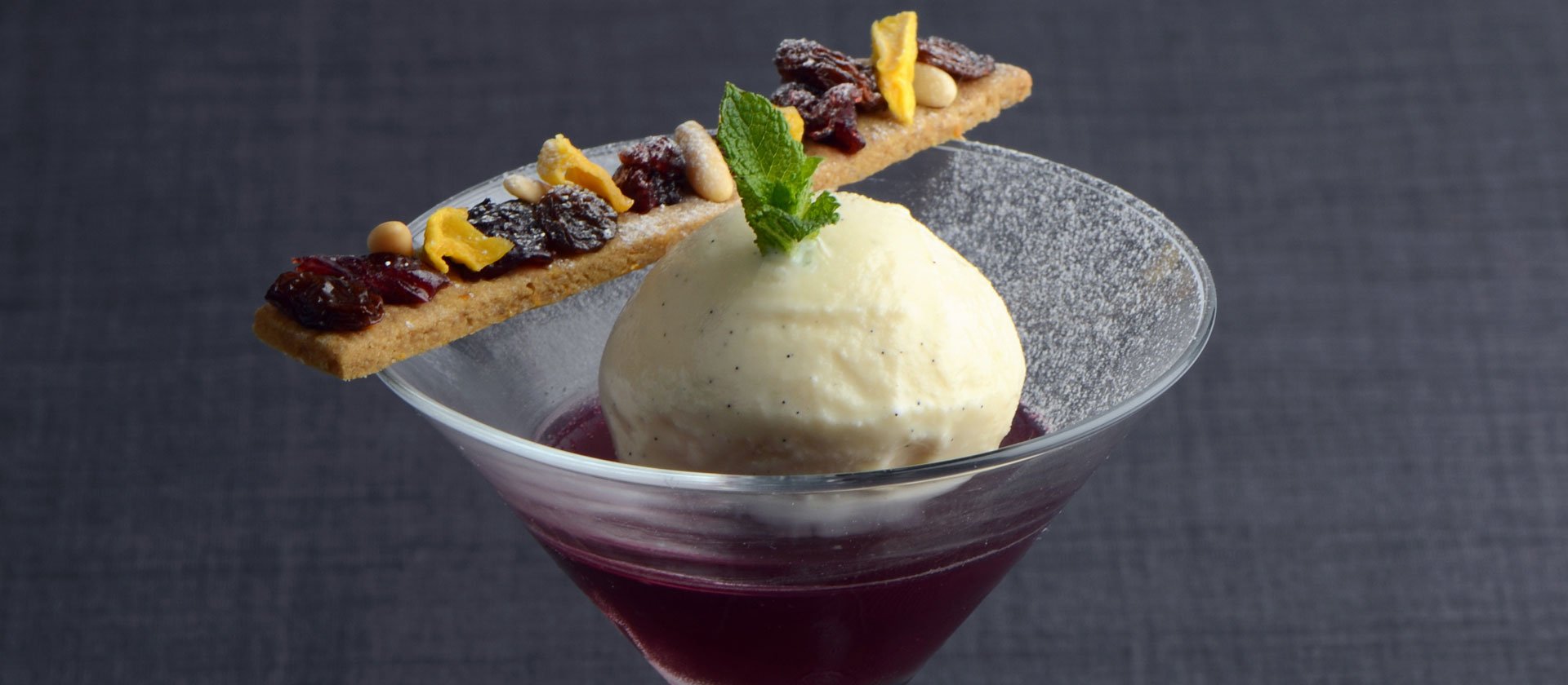 Mulled wine jelly, vanilla ice cream and speculoos biscuit with dried fruits and nuts