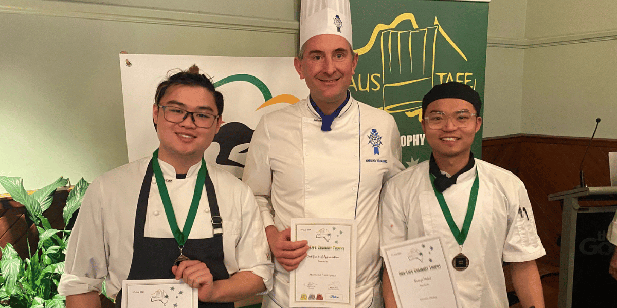 Le Cordon Bleu Melbourne culinary trainer Mariano Velazquez (centre) with students Yuran Zhong and Leo Sun.